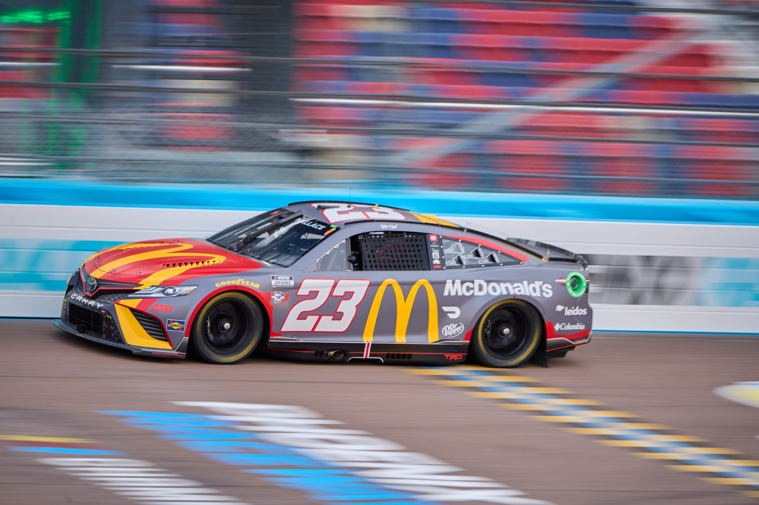 Mar 10, 2023; Avondale, AZ, USA; NASCAR Cup Series driver Bubba Wallace (23) crosses the start/finish line during the Cup Series practice session on Friday, March 10, 2023, at Phoenix Raceway. Mandatory Credit: Alex Gould/The Republic