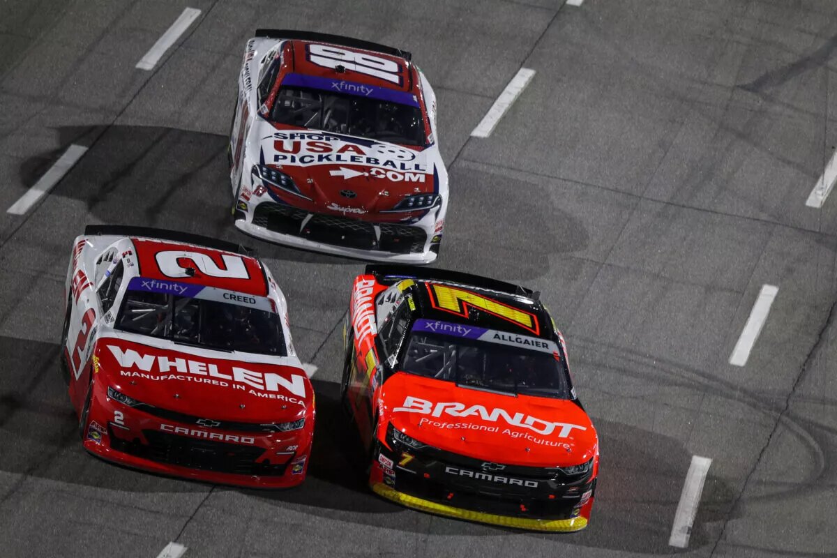 Credit: MARTINSVILLE, VIRGINIA - APRIL 08: Justin Allgaier, driver of the #7 BRANDT Chevrolet, Sheldon Creed, driver of the #2 Whelen Chevrolet, and Ryan Truex, driver of the #18 ShopUSAPickleball.com Toyota, race during the NASCAR Xfinity Series Call 811 Before You Dig 250 powered by Call 811.com at Martinsville Speedway on April 08, 2022 in Martinsville, Virginia. (Photo by Meg Oliphant/Getty Images)