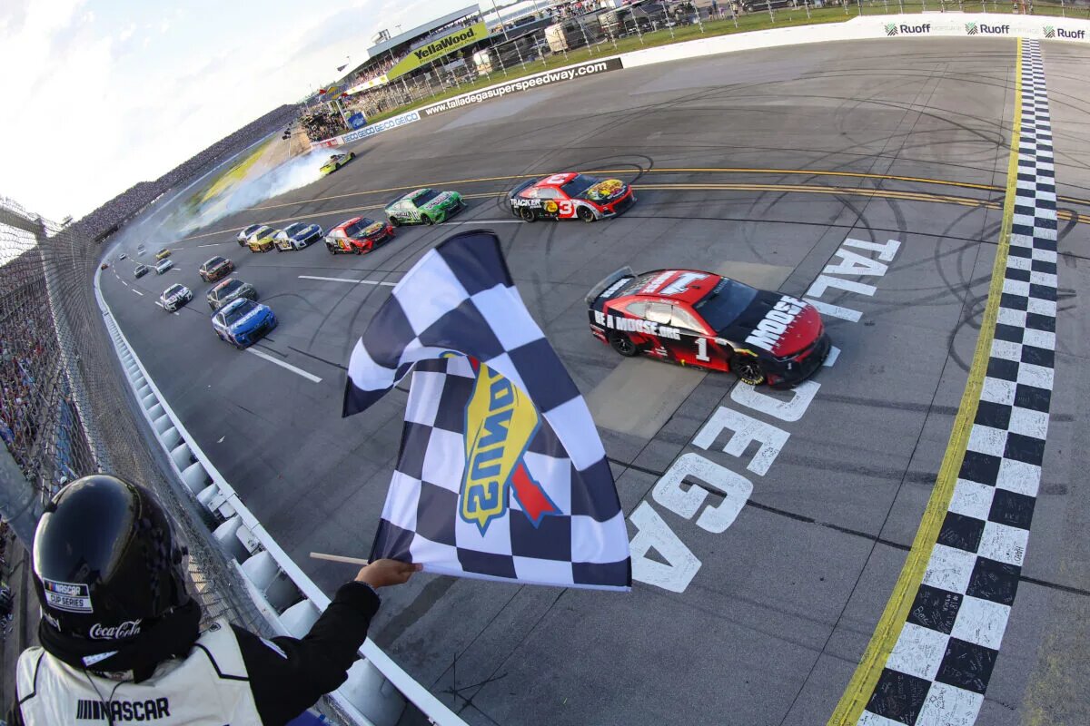 Credit: TALLADEGA, ALABAMA - APRIL 24: Ross Chastain, driver of the #1 Moose Fraternity Chevrolet, takes the checkered flag to win the NASCAR Cup Series GEICO 500 at Talladega Superspeedway on April 24, 2022 in Talladega, Alabama. (Photo by James Gilbert/Getty Images)