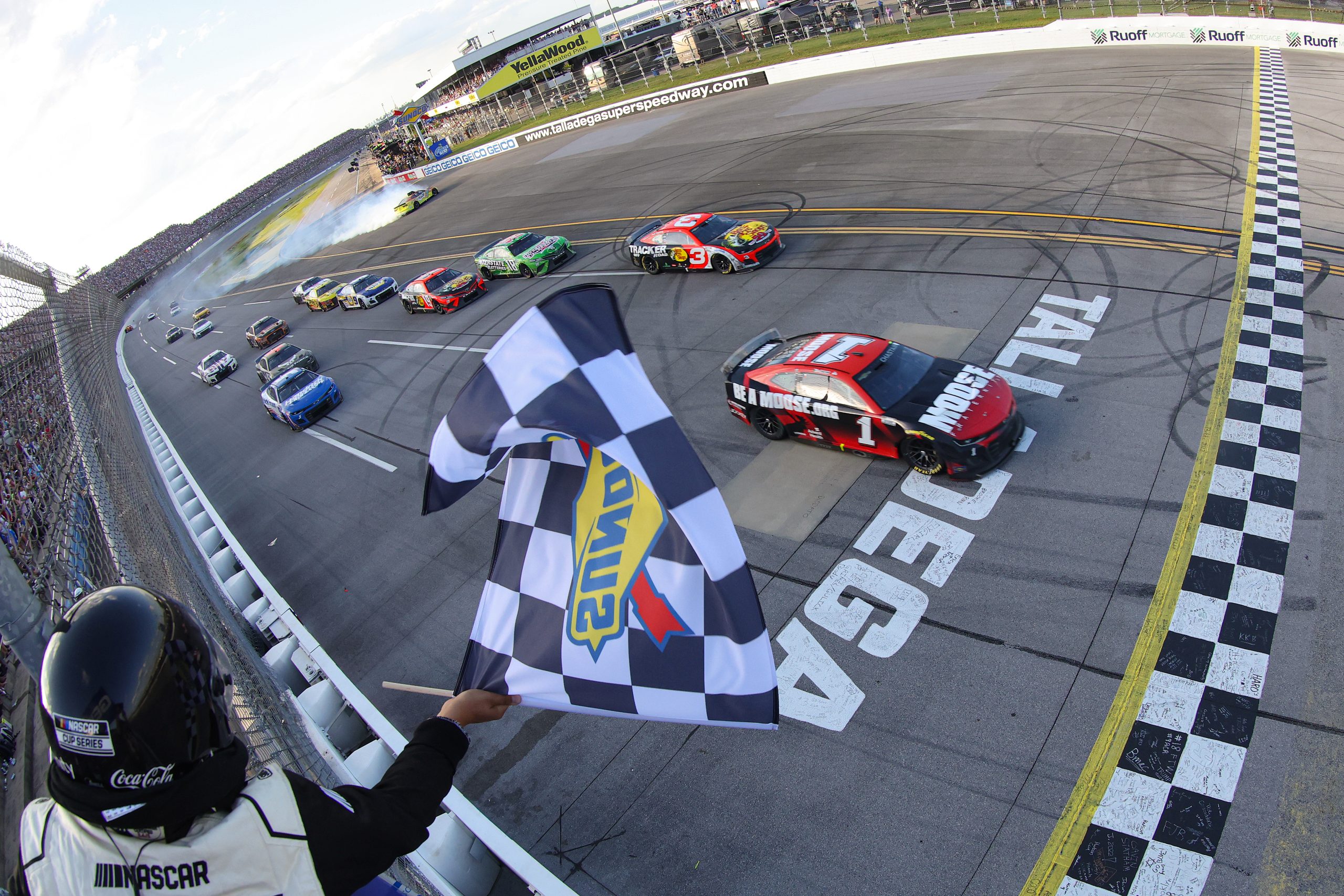 Credit: TALLADEGA, ALABAMA - APRIL 24: Ross Chastain, driver of the #1 Moose Fraternity Chevrolet, takes the checkered flag to win the NASCAR Cup Series GEICO 500 at Talladega Superspeedway on April 24, 2022 in Talladega, Alabama. (Photo by James Gilbert/Getty Images)