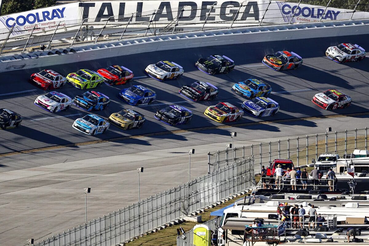 Credit: TALLADEGA, ALABAMA - OCTOBER 01: Trevor Bayne, driver of the #18 Dollar Concrete Toyota, leads the field during the NASCAR Xfinity Series Sparks 300 at Talladega Superspeedway on October 01, 2022 in Talladega, Alabama. (Photo by Chris Graythen/Getty Images)
