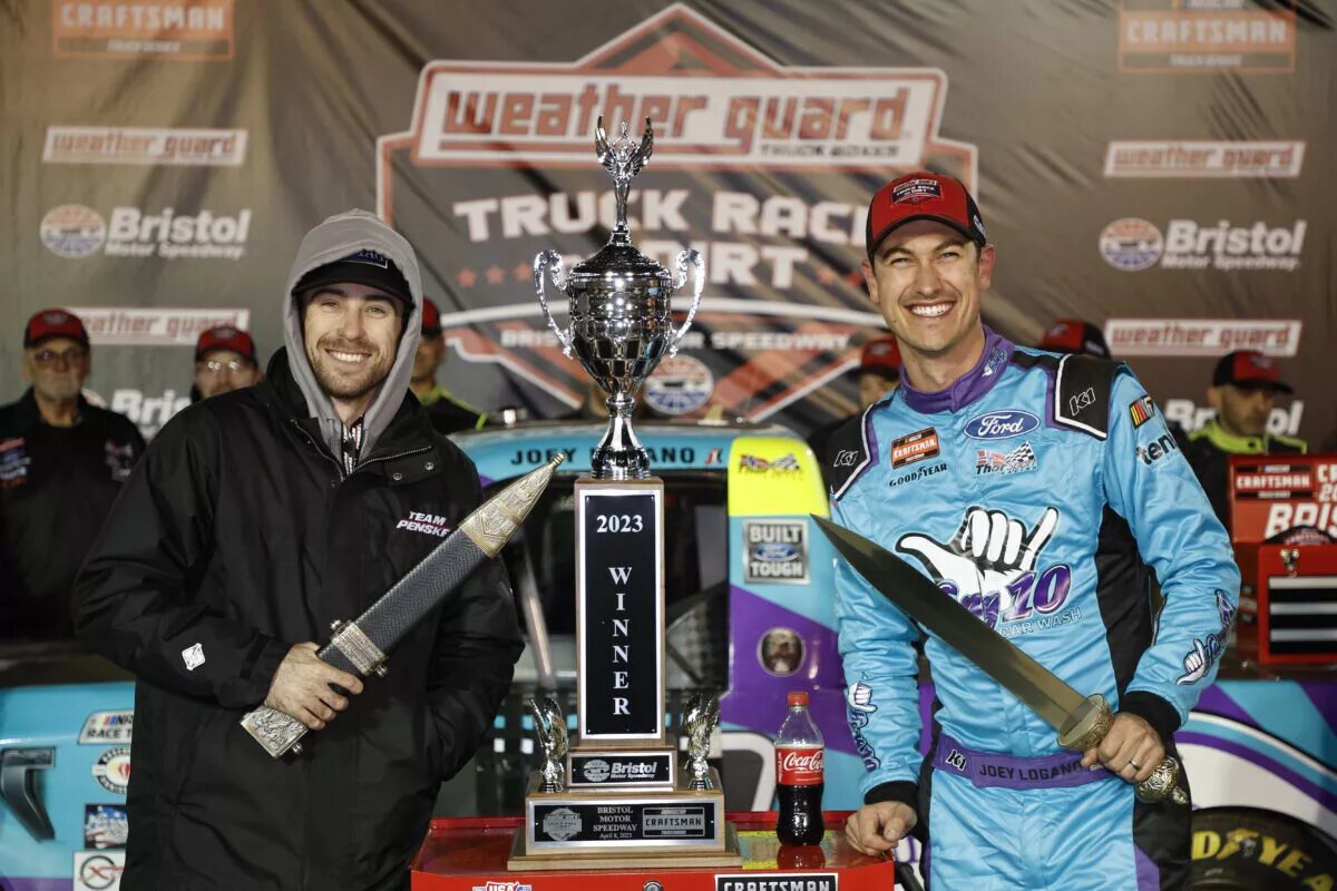 Credit: BRISTOL, TENNESSEE - APRIL 08: Joey Logano, driver of the #66 Hang 10 Car Wash Ford, and his spotter, NASCAR Cup Series driver Ryan Blaney, celebrate in victory lane after winning the NASCAR Craftsman Truck Series Weather Guard Truck Race on Dirt at Bristol Motor Speedway on April 08, 2023 in Bristol, Tennessee. (Photo by Jared C. Tilton/Getty Images)