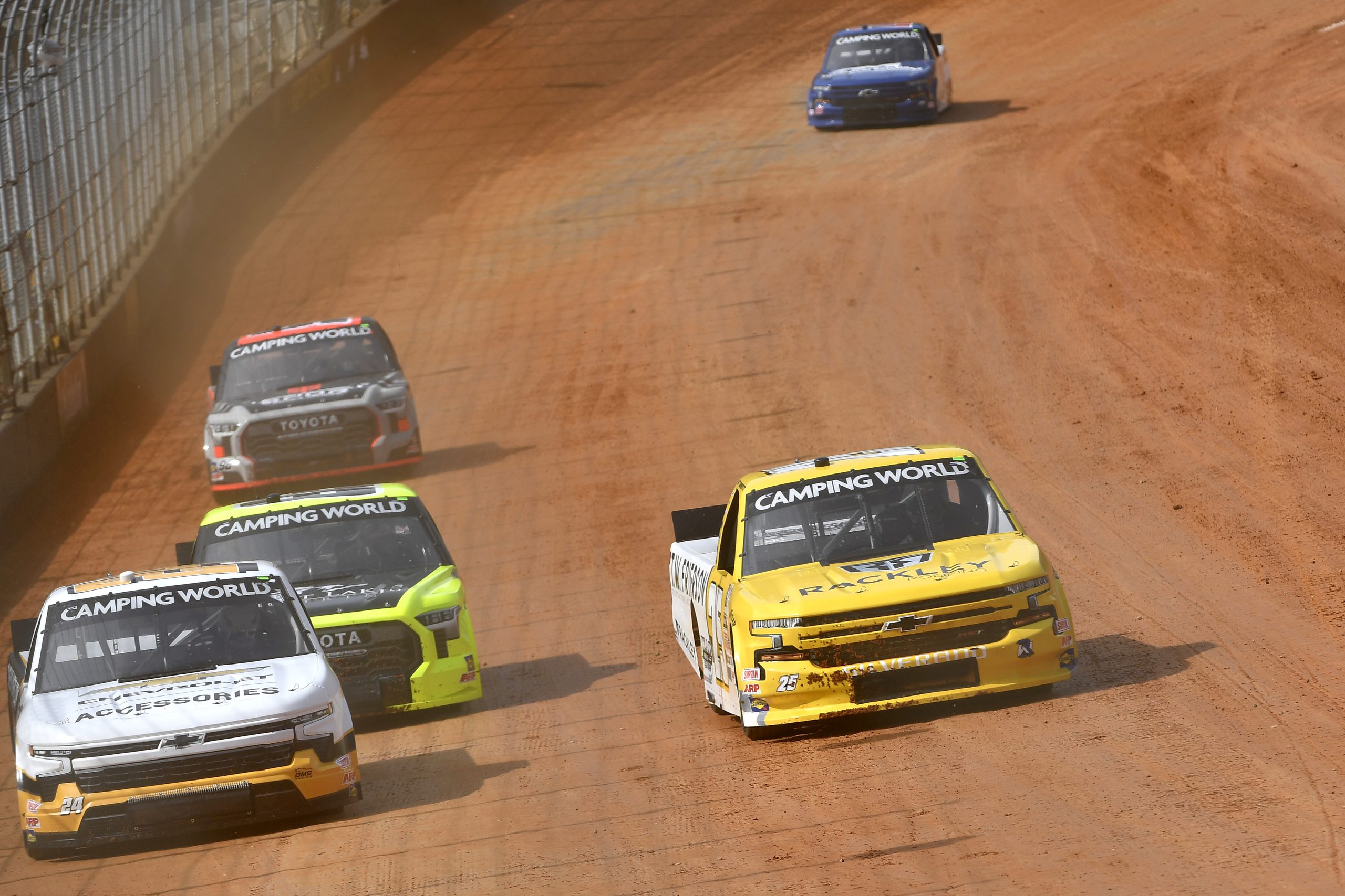 Credit: BRISTOL, TENNESSEE - APRIL 15: Jack Wood, driver of the #24 Chevyliners.com Chevrolet, and Matt Dibenedetto, driver of the #25 TW Frierson/Rackley Roofing Chevrolet, drive during first practice for the NASCAR Camping World Truck Series Pinty's Truck Race on Dirt at Bristol Motor Speedway on April 15, 2022 in Bristol, Tennessee. (Photo by Logan Riely/Getty Images)