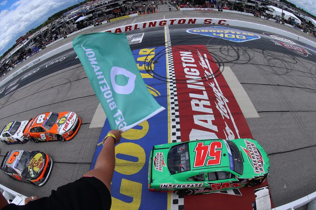 DARLINGTON, SOUTH CAROLINA - MAY 07: Ty Gibbs, driver of the #54 Interstate Batteries Toyota, leads the field to the green flag to start the NASCAR Xfinity Series Mahindra ROXOR 200 at Darlington Raceway on May 07, 2022 in Darlington, South Carolina. (Photo by Emilee Chinn/Getty Images)