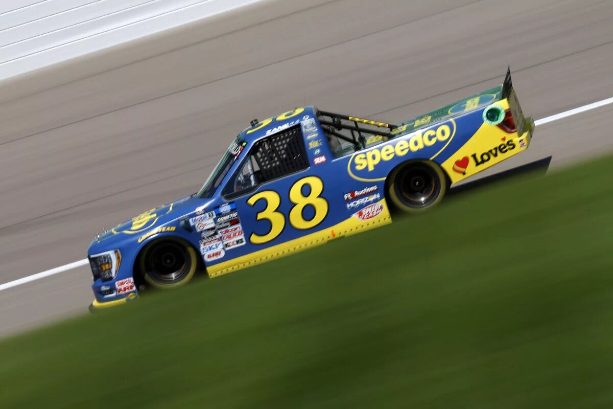 Credit: KANSAS CITY, KANSAS - MAY 14: Zane Smith, driver of the #38 Speedco Ford, drives during practice for the NASCAR Camping World Truck Series Heart of America 200 at Kansas Speedway on May 14, 2022 in Kansas City, Kansas. (Photo by Sean Gardner/Getty Images)