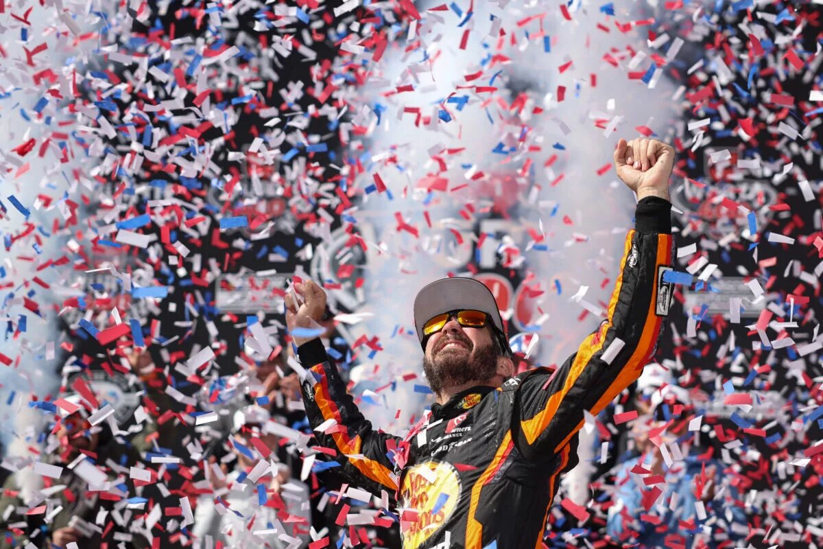 Credit: DOVER, DELAWARE - MAY 01: Martin Truex Jr., driver of the #19 Bass Pro Shops Toyota, celebrates in victory lane after winning the NASCAR Cup Series Würth 400 at Dover International Speedway on May 01, 2023 in Dover, Delaware. (Photo by James Gilbert/Getty Images)