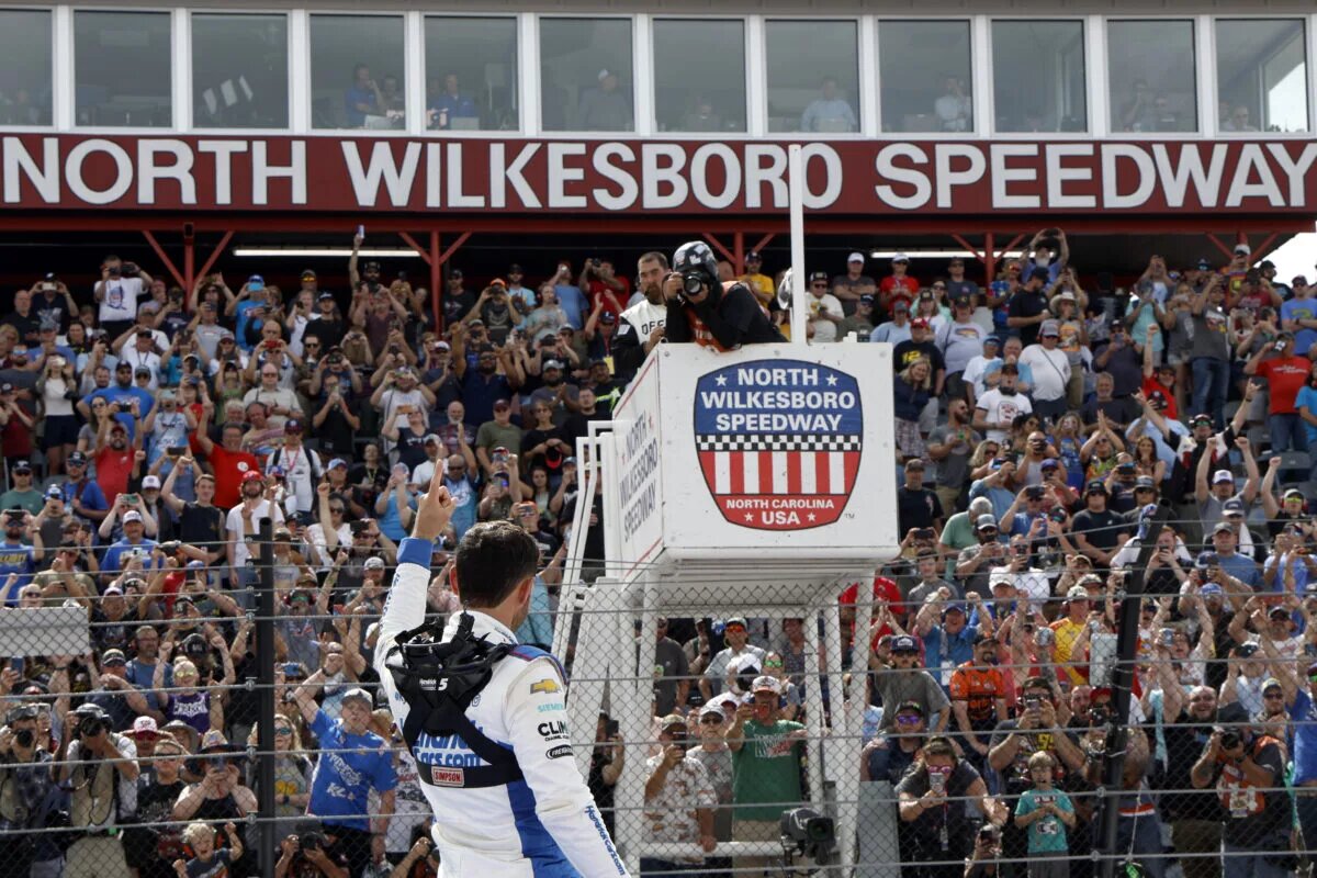NORTH WILKESBORO, NORTH CAROLINA - MAY 20: Kyle Larson, driver of the #7 HendrickCars.com Chevrolet, celebrates after winning the NASCAR Craftsman Truck Series Tyson 250 at North Wilkesboro Speedway on May 20, 2023 in North Wilkesboro, North Carolina. (Photo by Chris Graythen/Getty Images)