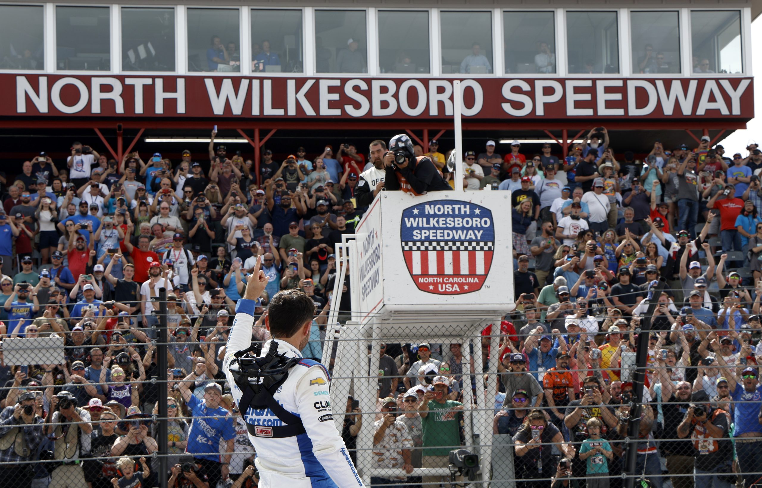 NORTH WILKESBORO, NORTH CAROLINA - MAY 20: Kyle Larson, driver of the #7 HendrickCars.com Chevrolet, celebrates after winning the NASCAR Craftsman Truck Series Tyson 250 at North Wilkesboro Speedway on May 20, 2023 in North Wilkesboro, North Carolina. (Photo by Chris Graythen/Getty Images)