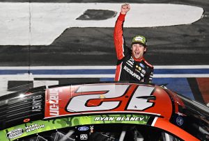 CONCORD, NORTH CAROLINA - MAY 29: Ryan Blaney, driver of the #12 BodyArmor Cherry Lime Ford, celebrates after winning the NASCAR Cup Series Coca-Cola 600 at Charlotte Motor Speedway on May 29, 2023 in Concord, North Carolina. (Photo by Logan Riely/Getty Images)