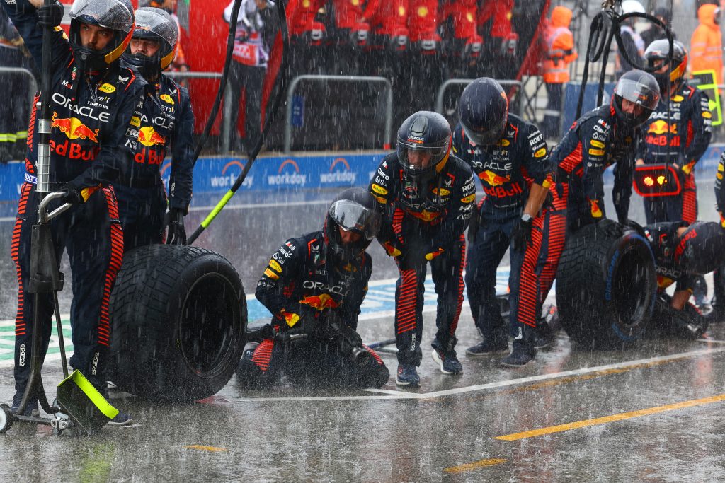 The Red Bull pit crew are ready for action in the pouring rain at the Dutch GP.