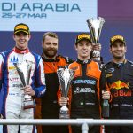 Felipe Drugovich on the top step of the podium in Jeddah.