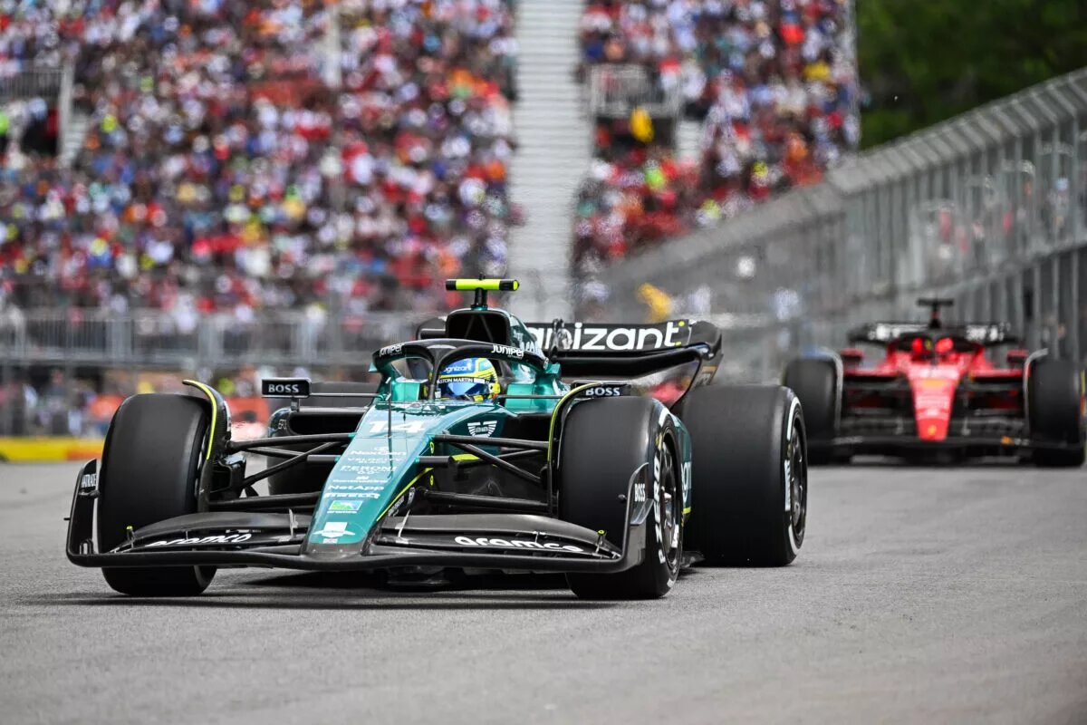 Fernando Alonso of Aston Martin ahead of Ferrari at the Canadian GP, 2023