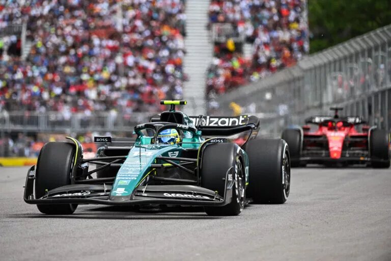 Fernando Alonso of Aston Martin ahead of Ferrari at the Canadian GP, 2023