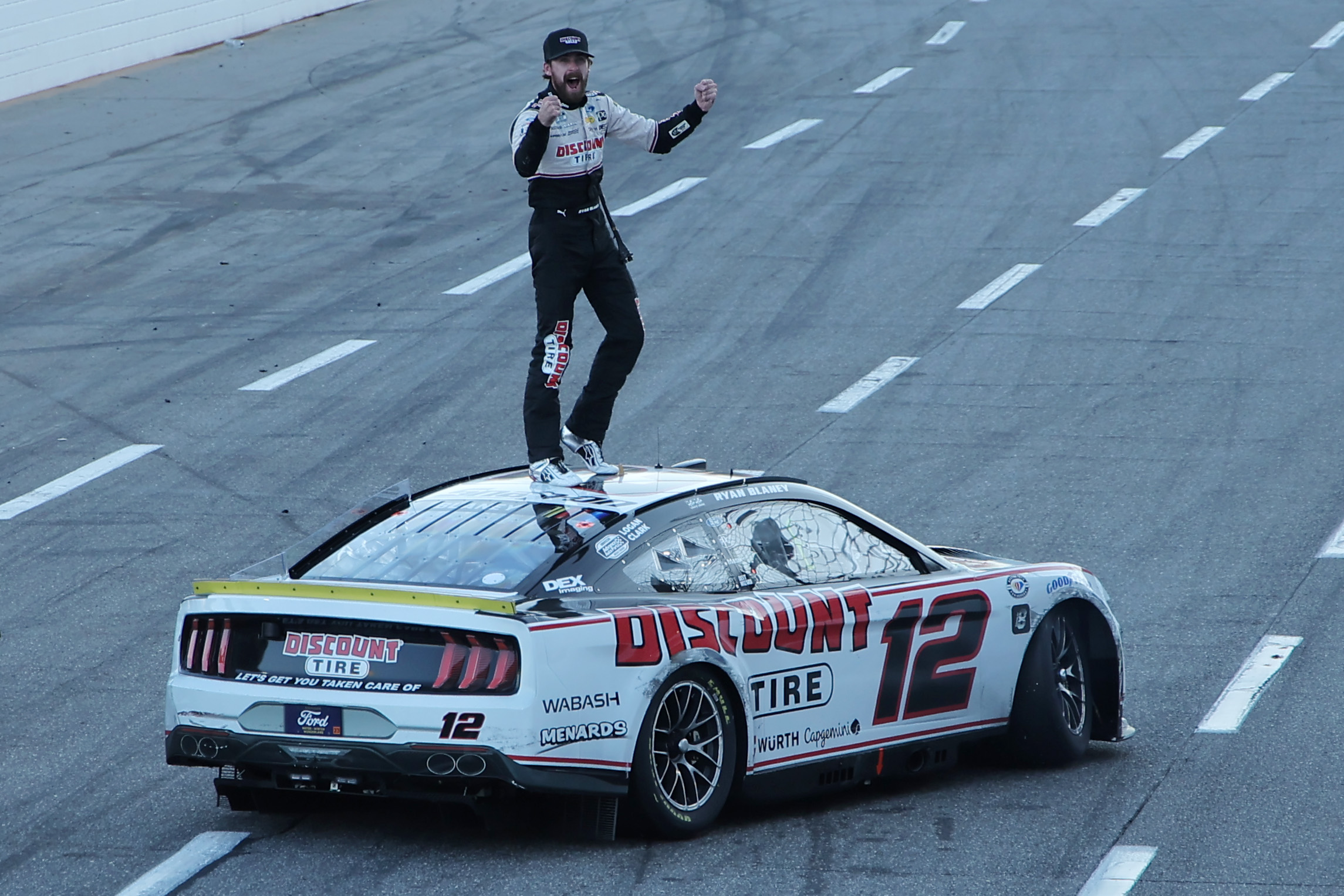 Ryan Blaney, driver of the #12 Discount Tire Ford, celebrates after winning the NASCAR Cup Series Xfinity 500 at Martinsville Speedway on October 29, 2023 in Martinsville, Virginia.