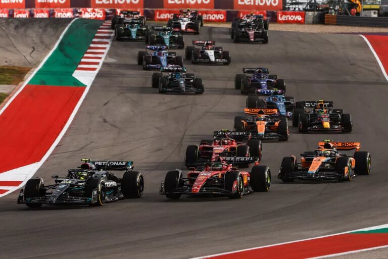 Lewis Hamilton fighting with Charles Leclerc at the start of the United States Grand Prix, 2023