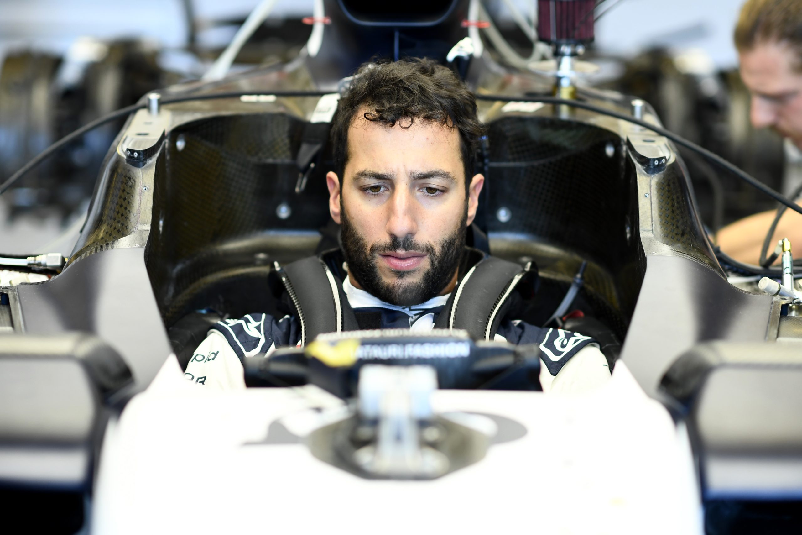 Daniel Ricciardo of Australia and Scuderia AlphaTauri has a seat fitting as he returns to racing