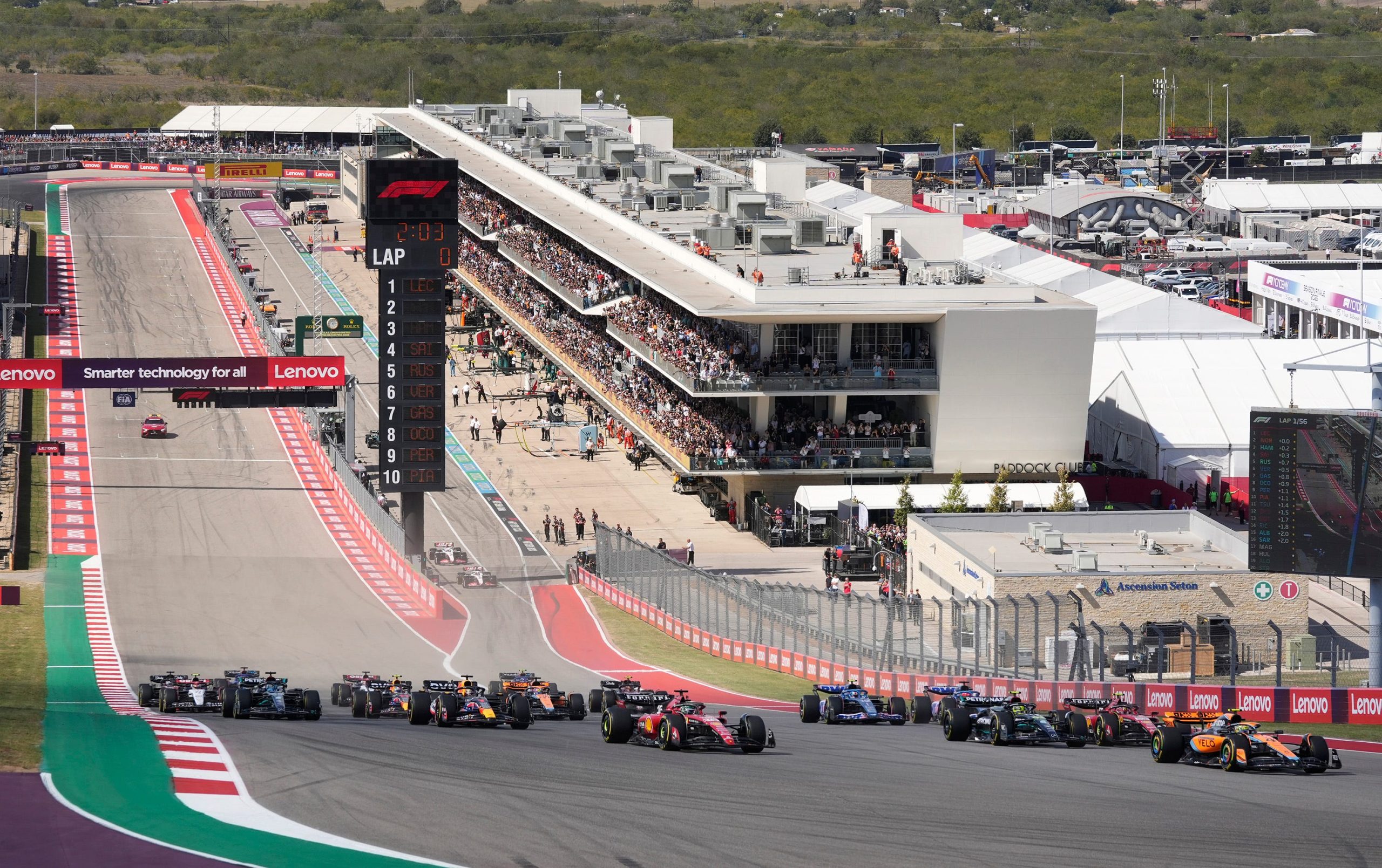 The grid storming into turn 1 at the United States Grand Prix, 2023