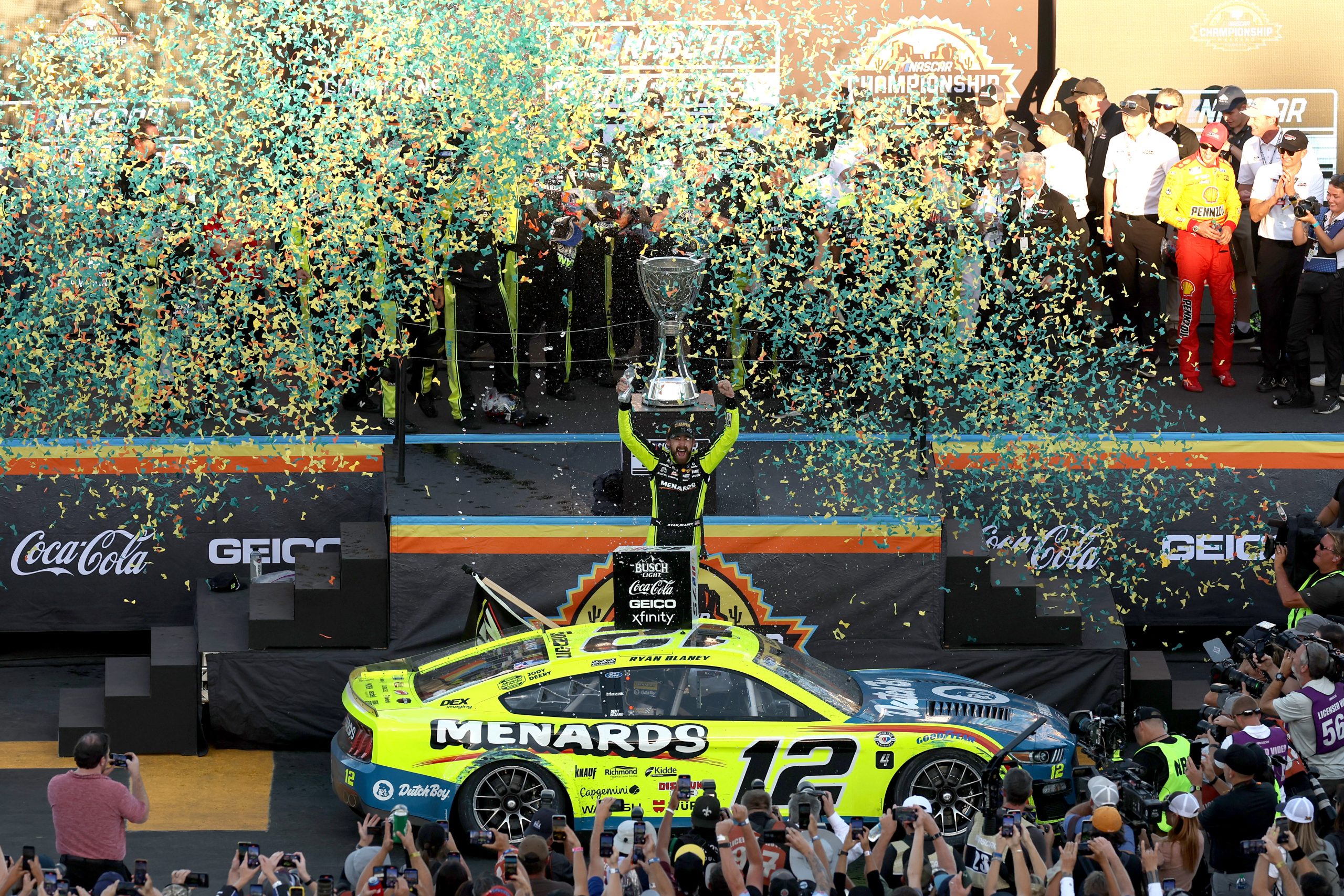 Ryan Blaney, driver of the #12 Menards/Dutch Boy Ford, celebrates in victory lane after winning the 2023 NASCAR Cup Series Championship, finishing first of the Championship 4 drivers in the NASCAR Cup Series Championship race at Phoenix Raceway on November 05, 2023 in Avondale, Arizona.