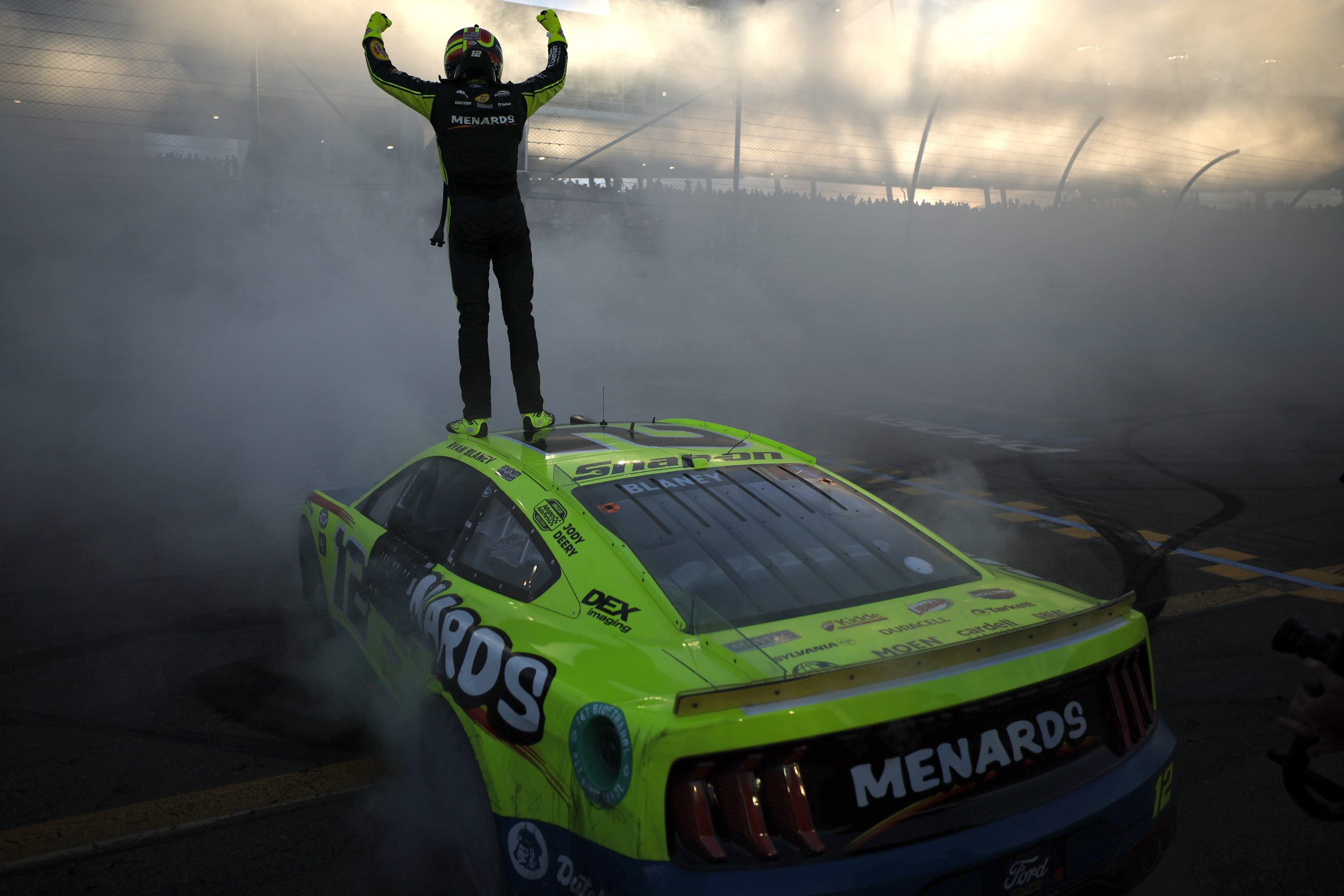 Ryan Blaney, driver of the #12 Menards/Dutch Boy Ford, celebrates after winning the 2023 NASCAR Cup Series Championship, finishing first of the Championship 4 drivers in the NASCAR Cup Series Championship race at Phoenix Raceway on November 05, 2023 in Avondale, Arizona.