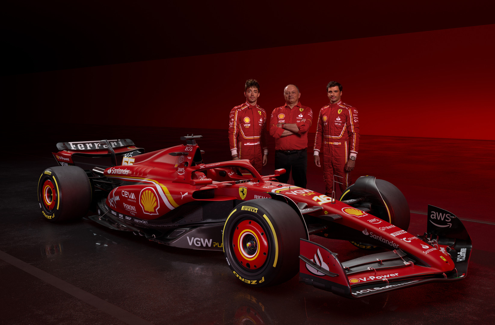 Charles Leclerc, Fred Vasseur & Carlos Sainz standing next to the new Ferrari
