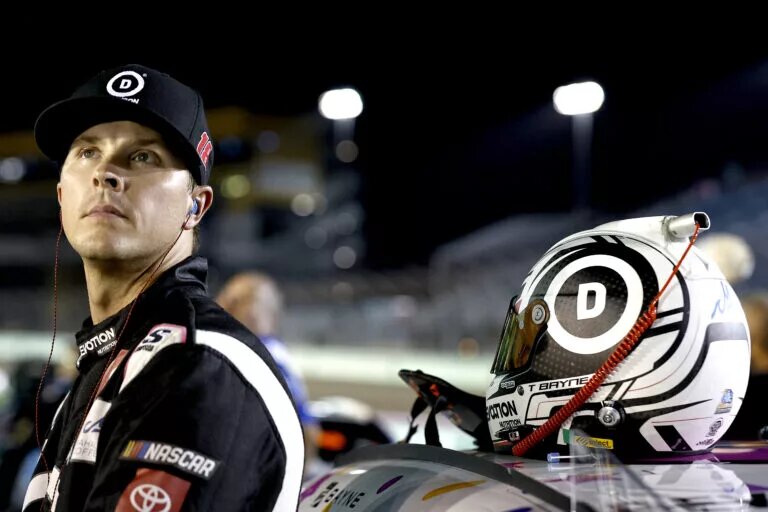 Trevor Bayne, driver of the #18 Devotion Nutrition Toyota, stands on pit road during qualifying for the NASCAR Xfinity Series Contender Boats 300 at Homestead-Miami Speedway on October 21, 2022 in Homestead, Florida. (Photo by Sean Gardner/Getty Images)
