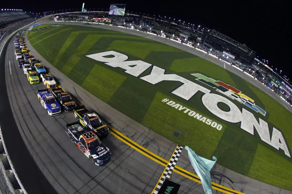 Ty Majeski, driver of the #98 Road Ranger Ford, and Nick Sanchez, driver of the #2 Gainbridge Chevrolet, lead the field to the green flag to start during the NASCAR Craftsman Truck Series NextEra Energy 250 at Daytona International Speedway on February 17, 2023 in Daytona Beach, Florida.
