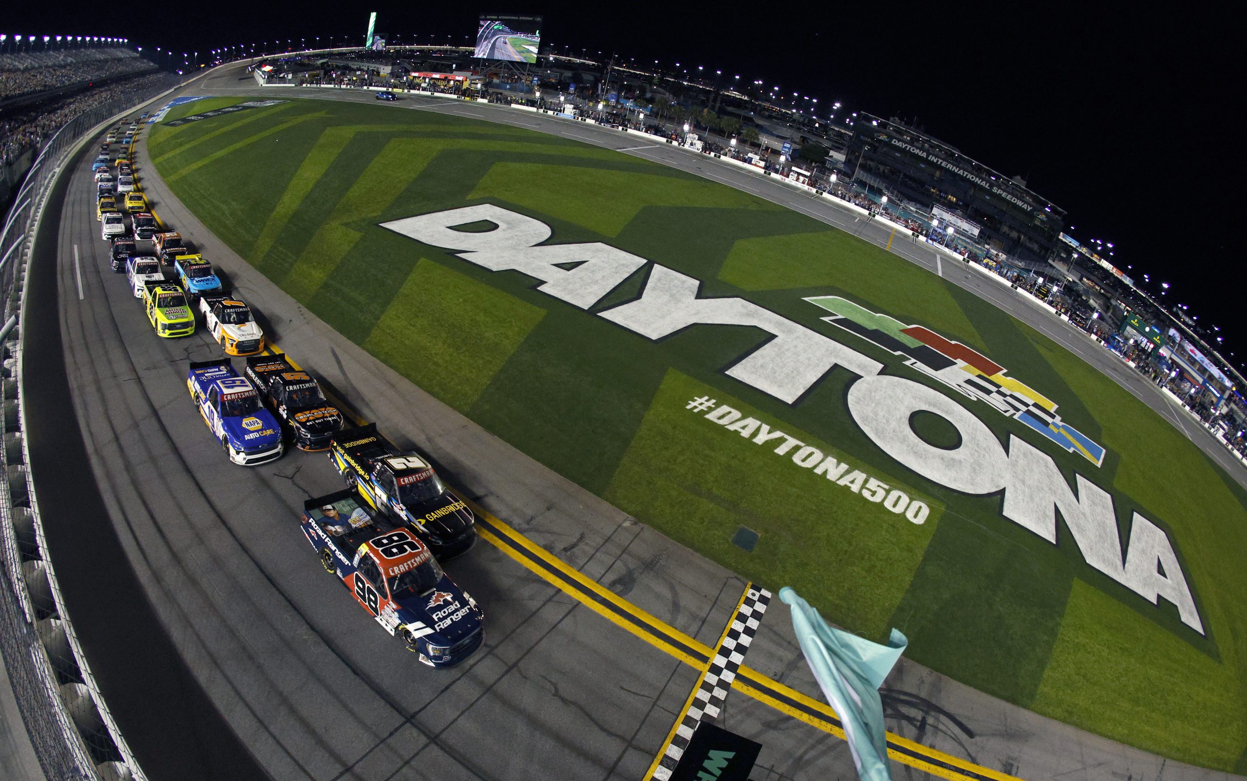Ty Majeski, driver of the #98 Road Ranger Ford, and Nick Sanchez, driver of the #2 Gainbridge Chevrolet, lead the field to the green flag to start during the NASCAR Craftsman Truck Series NextEra Energy 250 at Daytona International Speedway on February 17, 2023 in Daytona Beach, Florida.