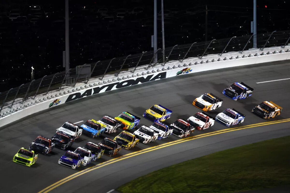 Christian Eckes, driver of the #19 NAPA AutoCare Chevrolet, and Matt Crafton, driver of the #88 Mold-Armor/Menards Ford, lead the field during the NASCAR Craftsman Truck Series NextEra Energy 250 at Daytona International Speedway on February 17, 2023 in Daytona Beach, Florida.