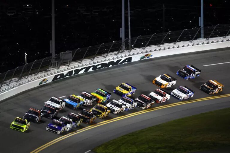 Christian Eckes, driver of the #19 NAPA AutoCare Chevrolet, and Matt Crafton, driver of the #88 Mold-Armor/Menards Ford, lead the field during the NASCAR Craftsman Truck Series NextEra Energy 250 at Daytona International Speedway on February 17, 2023 in Daytona Beach, Florida.