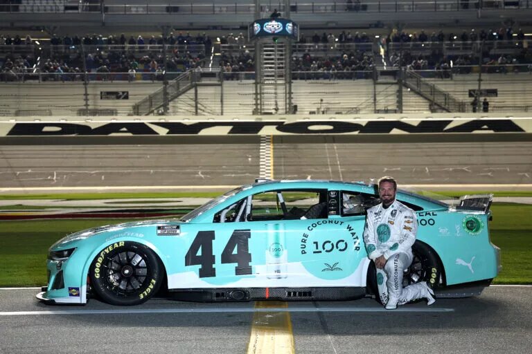 JJ Yeley, driver of the #44 100 Coconut Water Chevrolet, poses for a photo on the grid during qualifying for the NASCAR Cup Series Daytona 500 at Daytona International Speedway on February 14, 2024 in Daytona Beach, Florida. (Photo by Jared C. Tilton/Getty Images)
