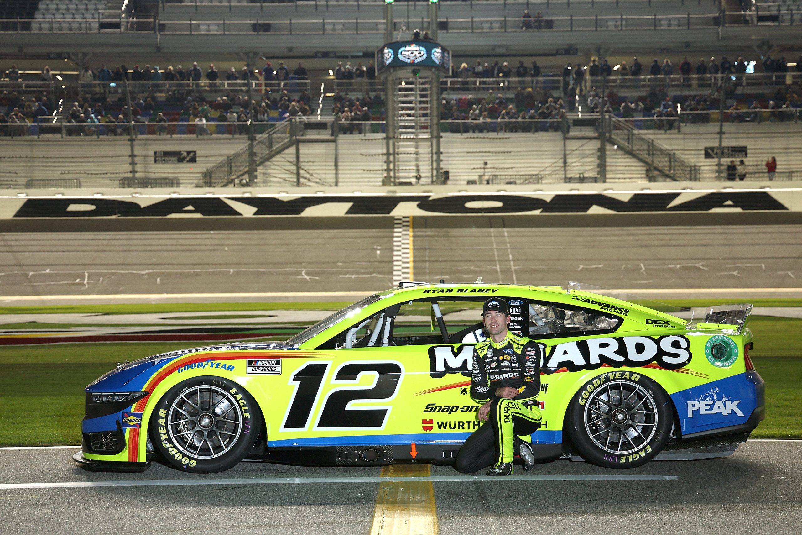 Ryan Blaney, driver of the #12 Menards/PEAK Ford, poses for a photo on the grid during qualifying for the NASCAR Cup Series Daytona 500 at Daytona International Speedway on February 14, 2024 in Daytona Beach, Florida.