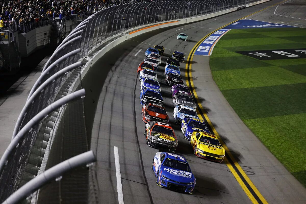 Kyle Larson, driver of the #5 HendrickCars.com Chevrolet, and Joey Logano, driver of the #22 Shell Pennzoil Ford, lead the field during the NASCAR Cup Series Bluegreen Vacations Duel #1 at Daytona International Speedway on February 15, 2024 in Daytona Beach, Florida.