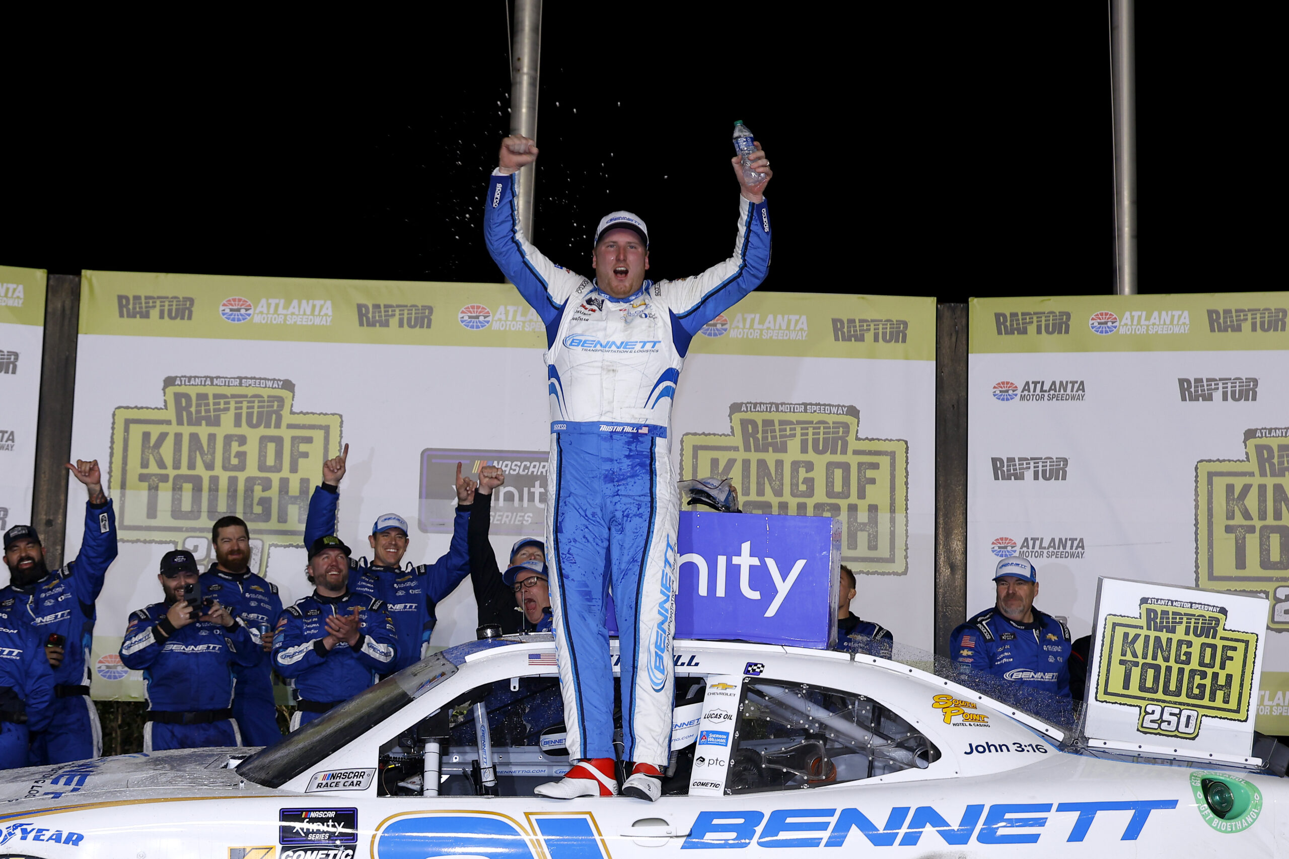 Austin Hill, driver of the #21 Bennett Transportation Chevrolet, celebrates in victory lane after winning the NASCAR Xfinity Series King of Tough 250 at Atlanta Motor Speedway on February 24, 2024 in Hampton, Georgia. (Photo by Todd Kirkland/Getty Images)
