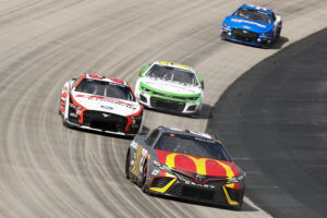 Bubba Wallace, driver of the #23 McDonald's Toyota, Harrison Burton, driver of the #21 DEX Imaging Ford, and AJ Allmendinger, driver of the #16 Nutrien Ag Solutions Chevrolet, race during the NASCAR Cup Series Würth 400 at Dover International Speedway on May 01, 2023 in Dover, Delaware.