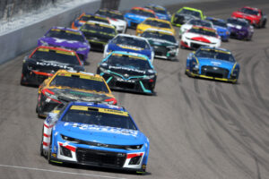 KANSAS CITY, KANSAS - SEPTEMBER 10: Kyle Larson, driver of the #5 HendrickCars.com Chevrolet, leads the field during the NASCAR Cup Series Hollywood Casino 400 at Kansas Speedway on September 10, 2023 in Kansas City, Kansas. (Photo by Jamie Squire/Getty Images). NASCAR Fantasy