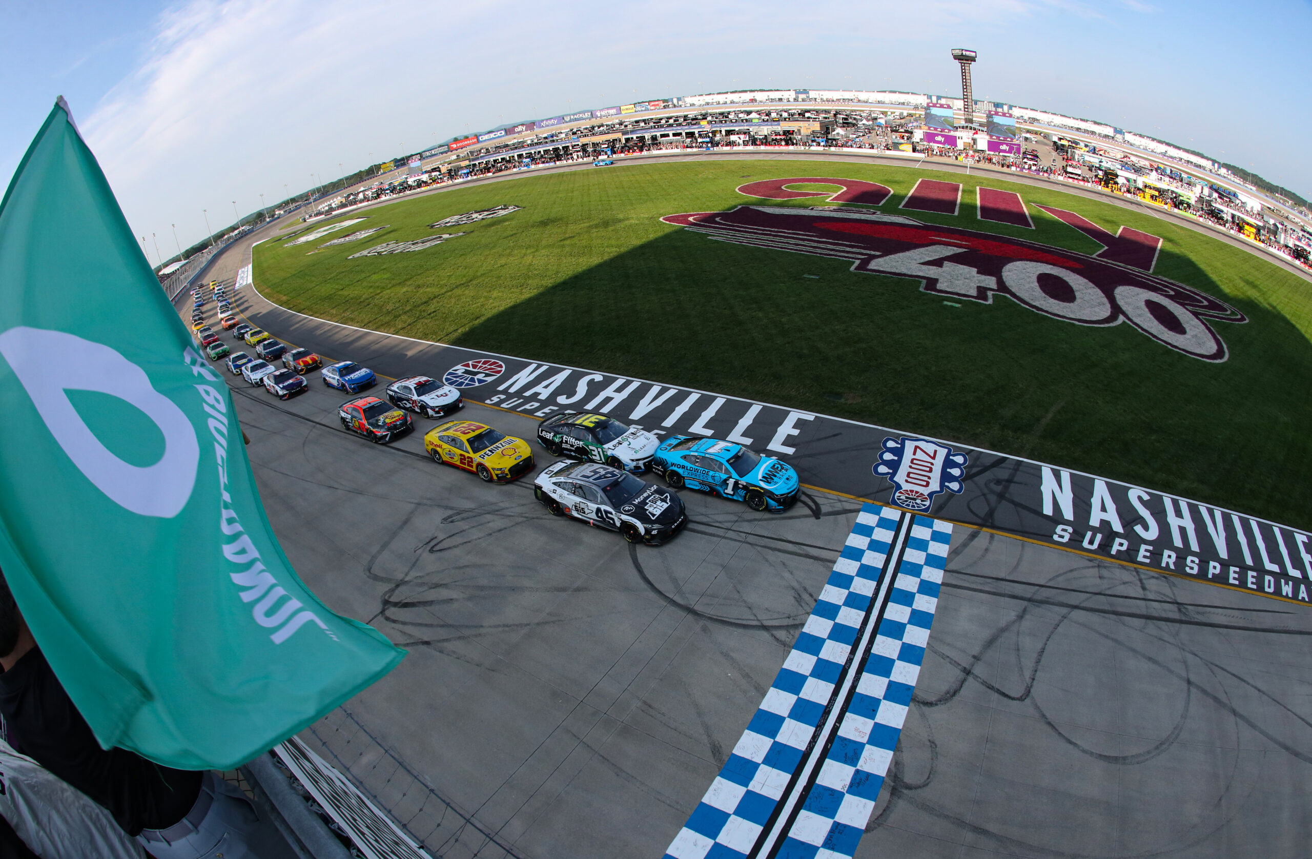LEBANON, TENNESSEE - JUNE 25: Ross Chastain, driver of the #1 Worldwide Express Chevrolet, leads the field to the green flag to start the NASCAR Cup Series Ally 400 at Nashville Superspeedway on June 25, 2023 in Lebanon, Tennessee. (Photo by Meg Oliphant/Getty Images)