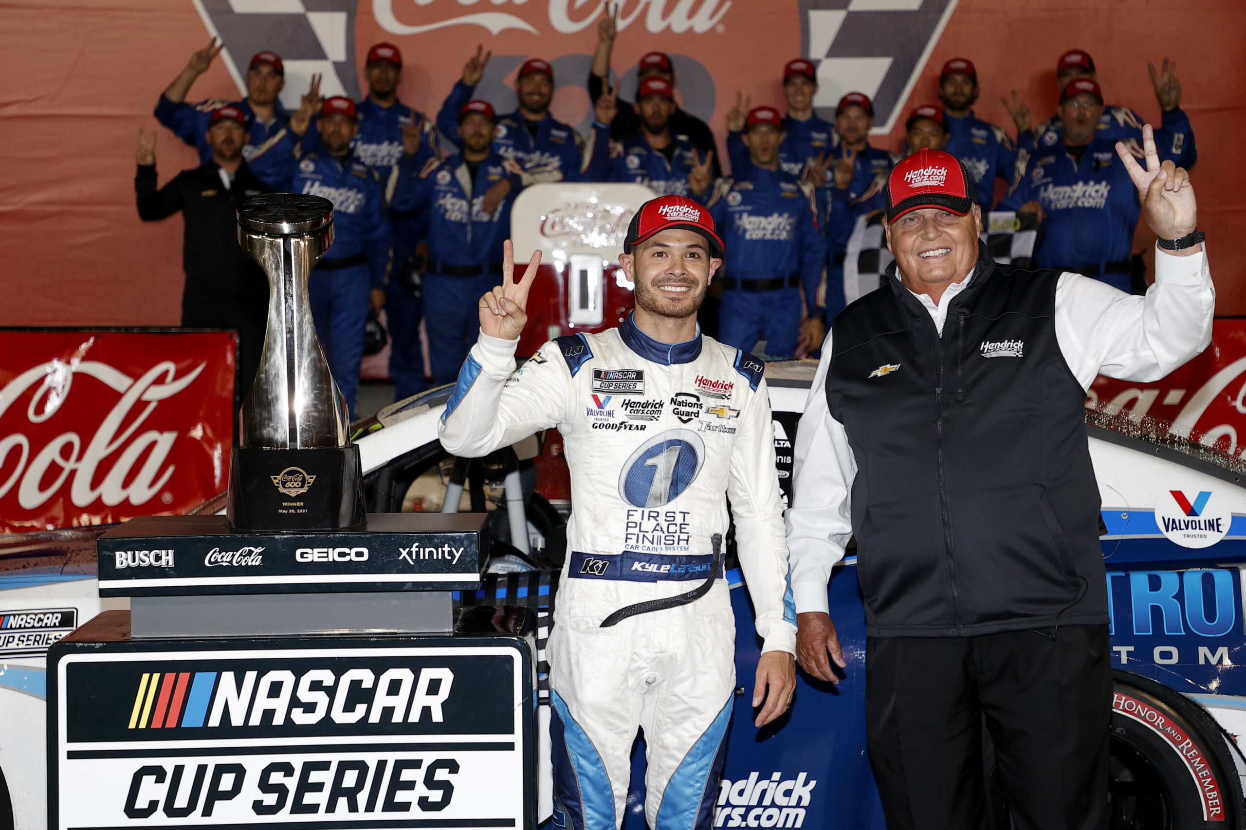 CONCORD, NORTH CAROLINA - MAY 30: Kyle Larson, driver of the #5 Metro Tech Chevrolet, and NASCAR Hall of Famer and team owner Rick Hendrick celebrate in victory lane after winning, the NASCAR Cup Series Coca-Cola 600, Hendrick Motorsports' 269th Cup Series win, the most in NASCAR at Charlotte Motor Speedway on May 30, 2021 in Concord, North Carolina. (Photo by Maddie Meyer/Getty Images)