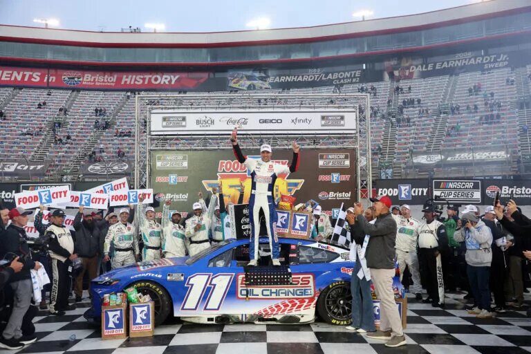 BRISTOL, TENNESSEE - MARCH 17: Denny Hamlin, driver of the #11 Express Oil Change Toyota, celebrates in victory lane after winning the NASCAR Cup Series Food City 500 at Bristol Motor Speedway on March 17, 2024 in Bristol, Tennessee. (Photo by Meg Oliphant/Getty Images)