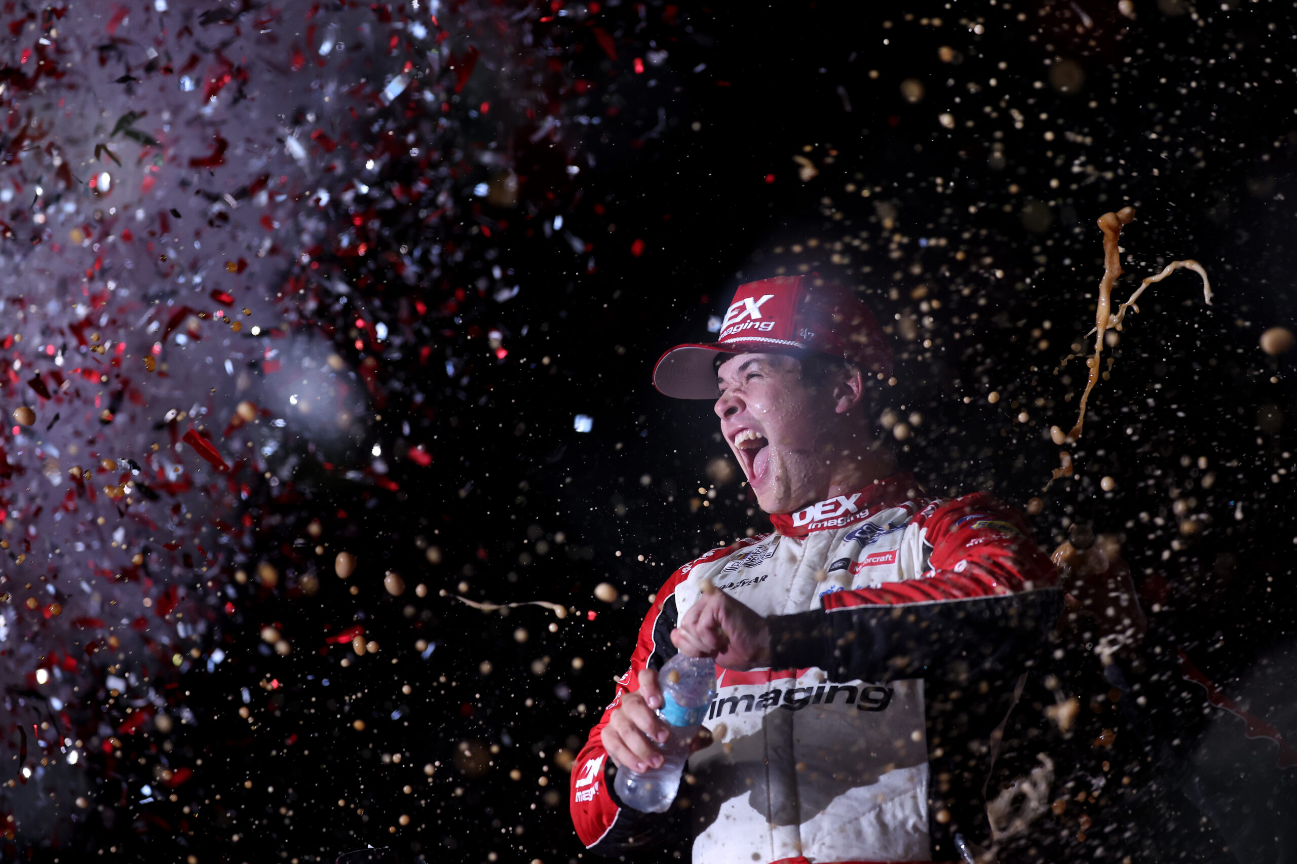 DAYTONA BEACH, FLORIDA - AUGUST 24: Harrison Burton, driver of the #21 DEX Imaging Ford, celebrates in victory lane after winning the NASCAR Cup Series Coke Zero Sugar 400 at Daytona International Speedway on August 24, 2024 in Daytona Beach, Florida. (Photo by James Gilbert/Getty Images)