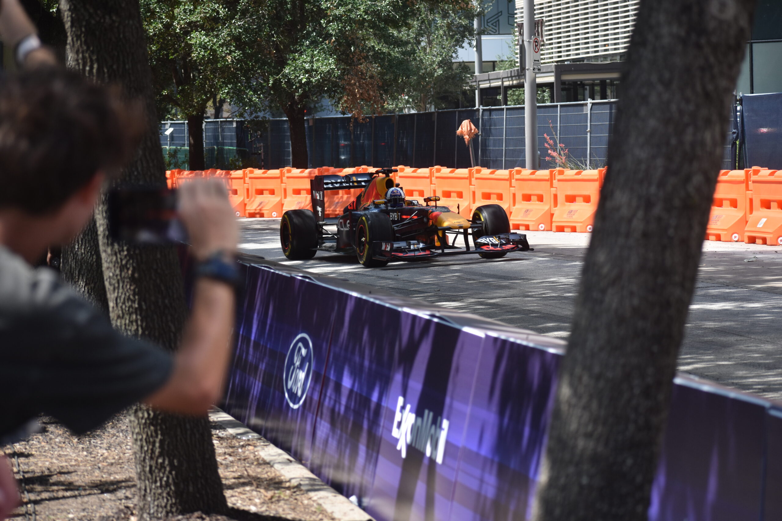 A fan takes a video of David Coulthard racing the RB7 on the streets of Houston, Texas.