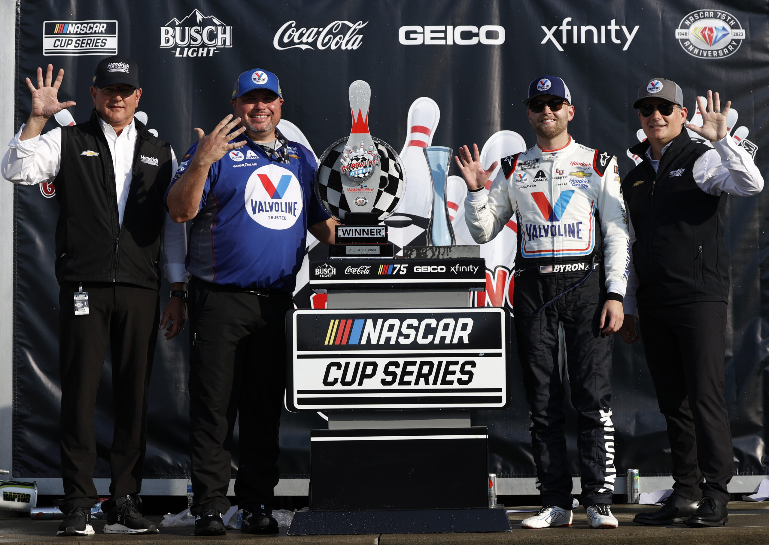 WATKINS GLEN, NEW YORK - AUGUST 20: (L-R) Jeff Andrews, President and General Manager at Hendrick Motorsports, crew chief Rudy Fugle, William Byron, driver of the #24 Valvoline Chevrolet, and Jeff Gordon, Vice Chairman of Hendrick Motorsports pose in victory lane after winning the NASCAR Cup Series Go Bowling at The Glen at Watkins Glen International on August 20, 2023 in Watkins Glen, New York. (Photo by Chris Graythen/Getty Images)