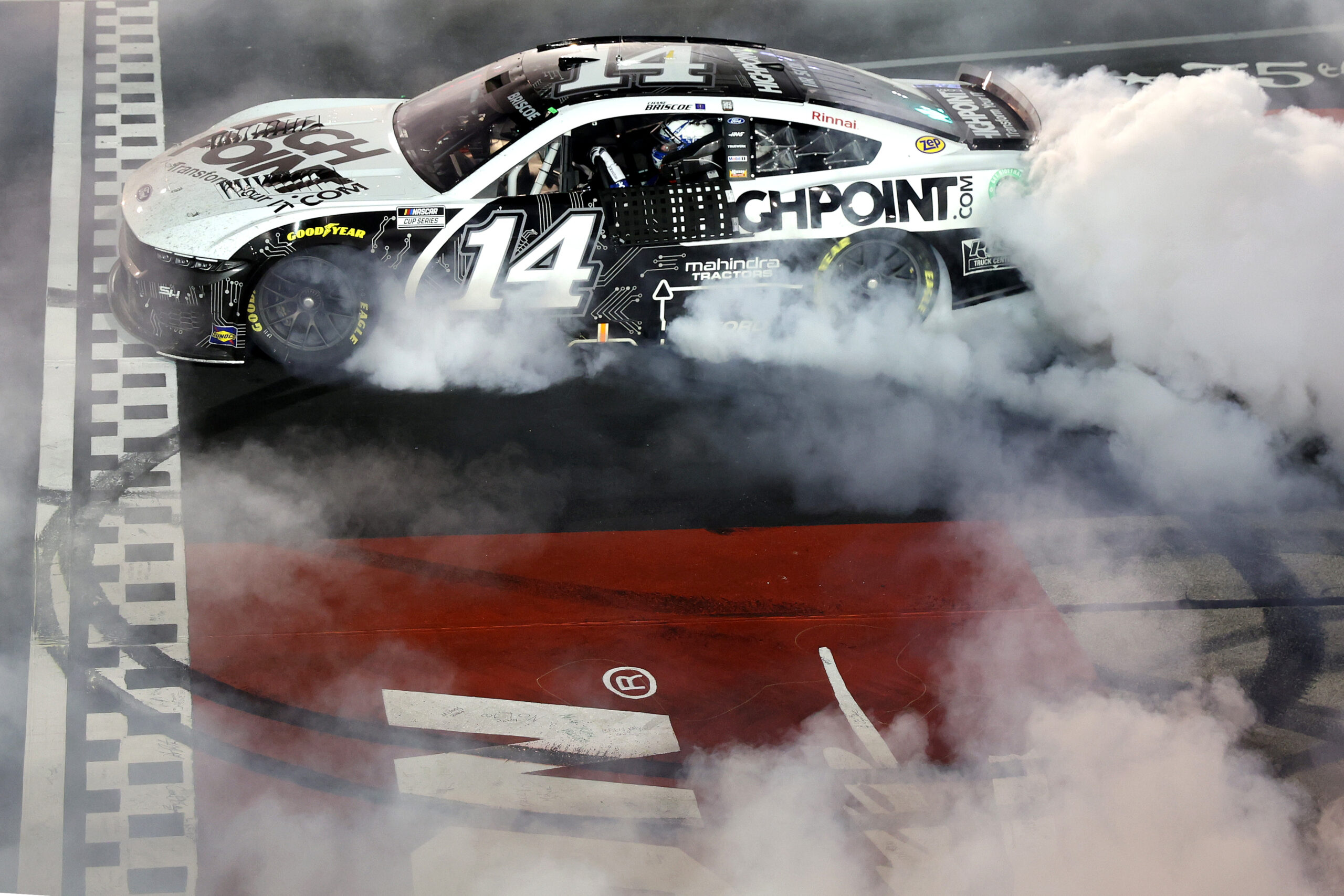 DARLINGTON, SOUTH CAROLINA - SEPTEMBER 01: Chase Briscoe, driver of the #14 HighPoint.com Ford, celebrates with a burnout after winning the NASCAR Cup Series Cook Out Southern 500 at Darlington Raceway on September 01, 2024 in Darlington, South Carolina. (Photo by Meg Oliphant/Getty Images)