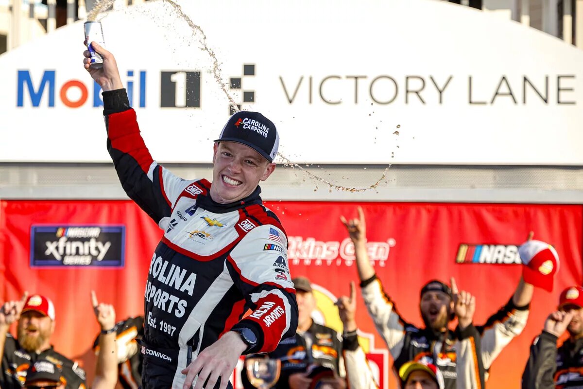 WATKINS GLEN, NEW YORK - SEPTEMBER 14: Connor Zilisch, driver of the #88 Carolina Carports Chevrolet, celebrates in victory lane after winning the NASCAR Xfinity Series Mission 200 at The Glen at Watkins Glen International on September 14, 2024 in Watkins Glen, New York. (Photo by Chris Graythen/Getty Images)