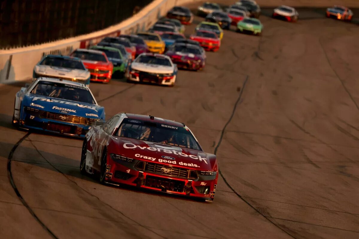 NEWTON, IOWA - JUNE 16: Josh Berry, driver of the #4 Overstock.com Ford, leads a pack of cars during the NASCAR Cup Series Iowa Corn 350 at Iowa Speedway on June 16, 2024 in Newton, Iowa. (Photo by Jonathan Bachman/Getty Images)
