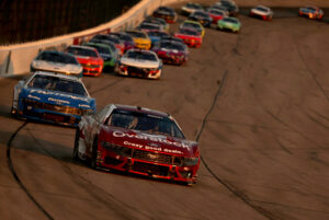 NEWTON, IOWA - JUNE 16: Josh Berry, driver of the #4 Overstock.com Ford, leads a pack of cars during the NASCAR Cup Series Iowa Corn 350 at Iowa Speedway on June 16, 2024 in Newton, Iowa. (Photo by Jonathan Bachman/Getty Images)