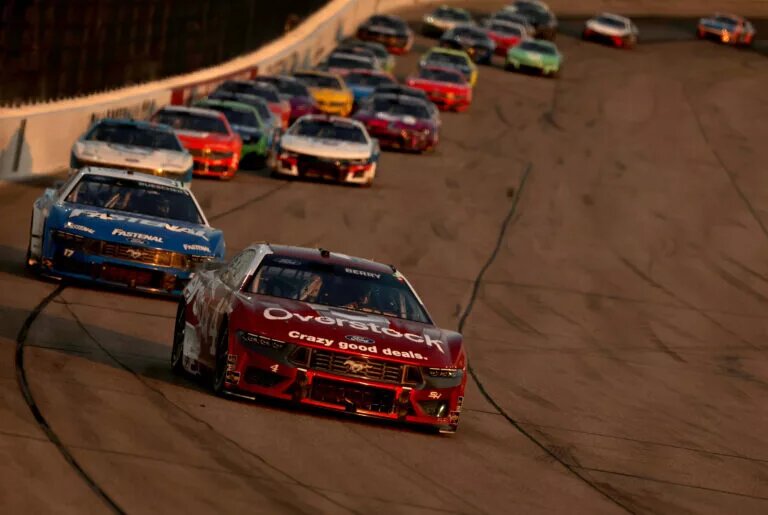 NEWTON, IOWA - JUNE 16: Josh Berry, driver of the #4 Overstock.com Ford, leads a pack of cars during the NASCAR Cup Series Iowa Corn 350 at Iowa Speedway on June 16, 2024 in Newton, Iowa. (Photo by Jonathan Bachman/Getty Images)