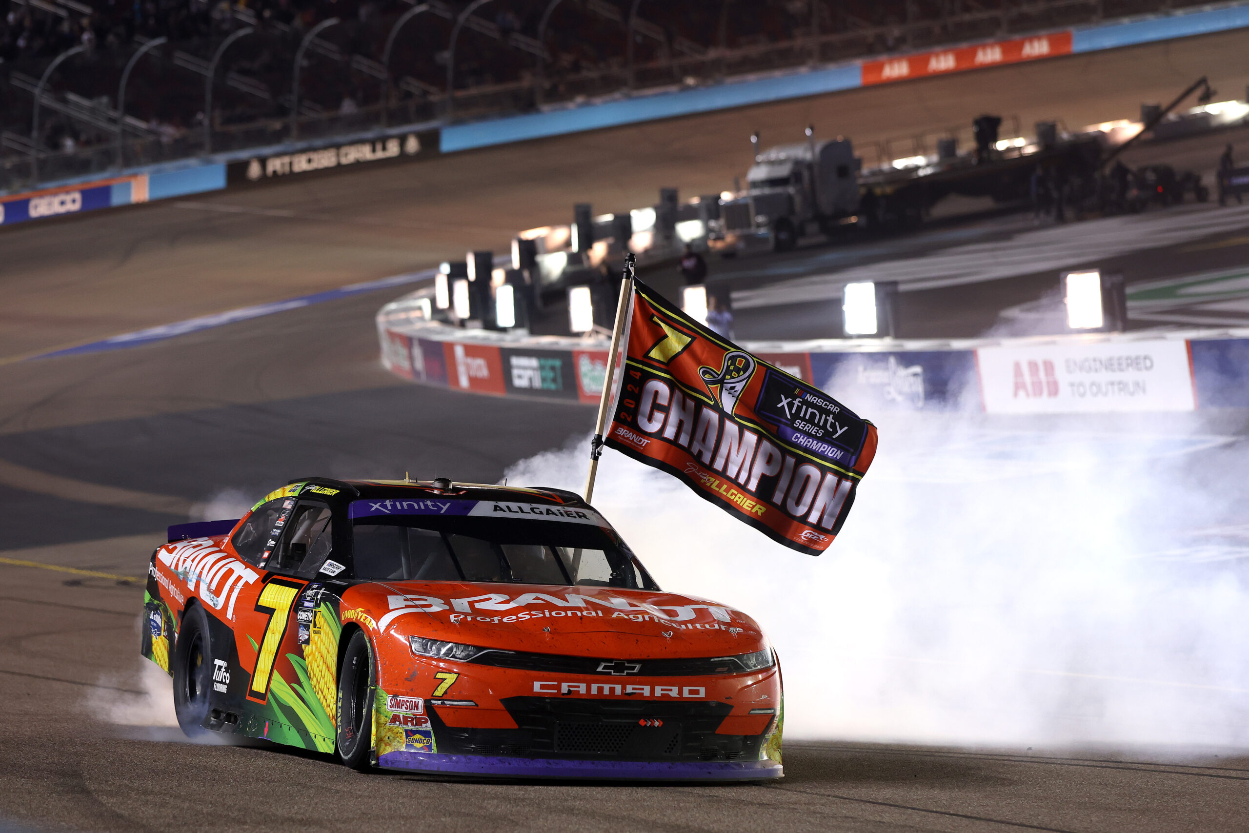 AVONDALE, ARIZONA - NOVEMBER 09: Justin Allgaier, driver of the #7 BRANDT Chevrolet, celebrates with a burnout after winning the 2024 NASCAR Xfinity Series Championship in the NASCAR Xfinity Series Championship Race at Phoenix Raceway on November 09, 2024 in Avondale, Arizona. (Photo by Meg Oliphant/Getty Images)