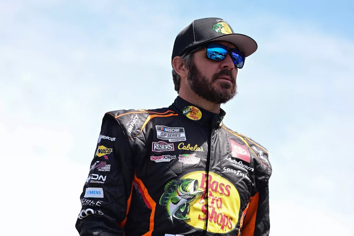 SONOMA, CALIFORNIA - JUNE 08: Martin Truex Jr., driver of the #19 Bass Pro Shops Toyota, walks the grid during qualifying for the NASCAR Cup Series Toyota/Save Mart 350 at Sonoma Raceway on June 08, 2024 in Sonoma, California. (Photo by Logan Riely/Getty Images) TRICON