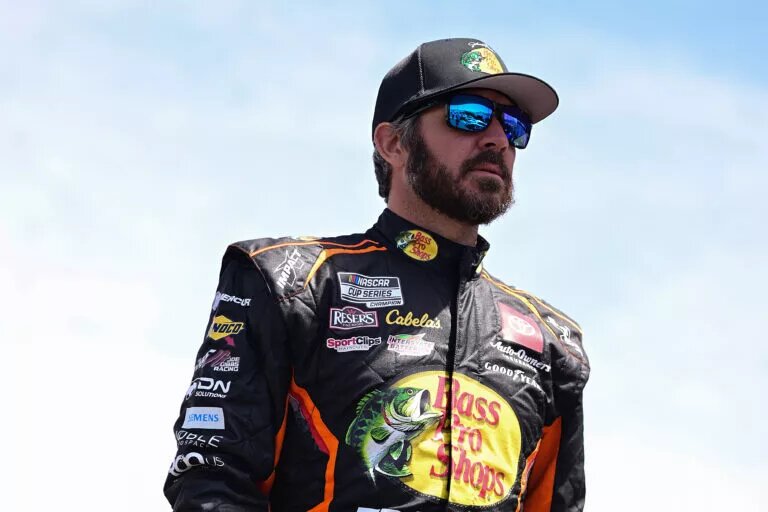 SONOMA, CALIFORNIA - JUNE 08: Martin Truex Jr., driver of the #19 Bass Pro Shops Toyota, walks the grid during qualifying for the NASCAR Cup Series Toyota/Save Mart 350 at Sonoma Raceway on June 08, 2024 in Sonoma, California. (Photo by Logan Riely/Getty Images) TRICON