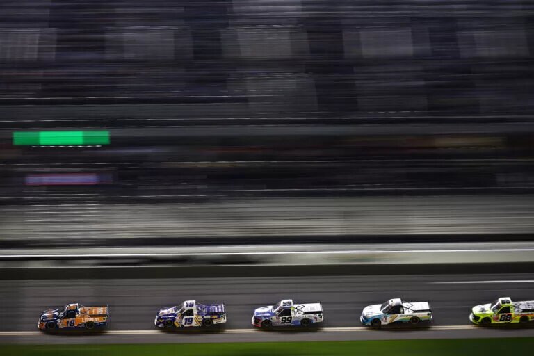 DAYTONA BEACH, FLORIDA - FEBRUARY 16: Tyler Ankrum, driver of the #18 LiUNA! Chevrolet, Christian Eckes, driver of the #19 NAPA Auto Care Chevrolet, Ben Rhodes, driver of the #99 Ranch Fuel Energy Drink Ford, Corey LaJoie, driver of the #7 Bluegreen Vacations Chevrolet, and Matt Crafton, driver of the #88 Ideal Door/Menards Ford, race during the NASCAR Craftsman Truck Series Fresh from Florida 250 at Daytona International Speedway on February 16, 2024 in Daytona Beach, Florida. (Photo by Jared C. Tilton/Getty Images)